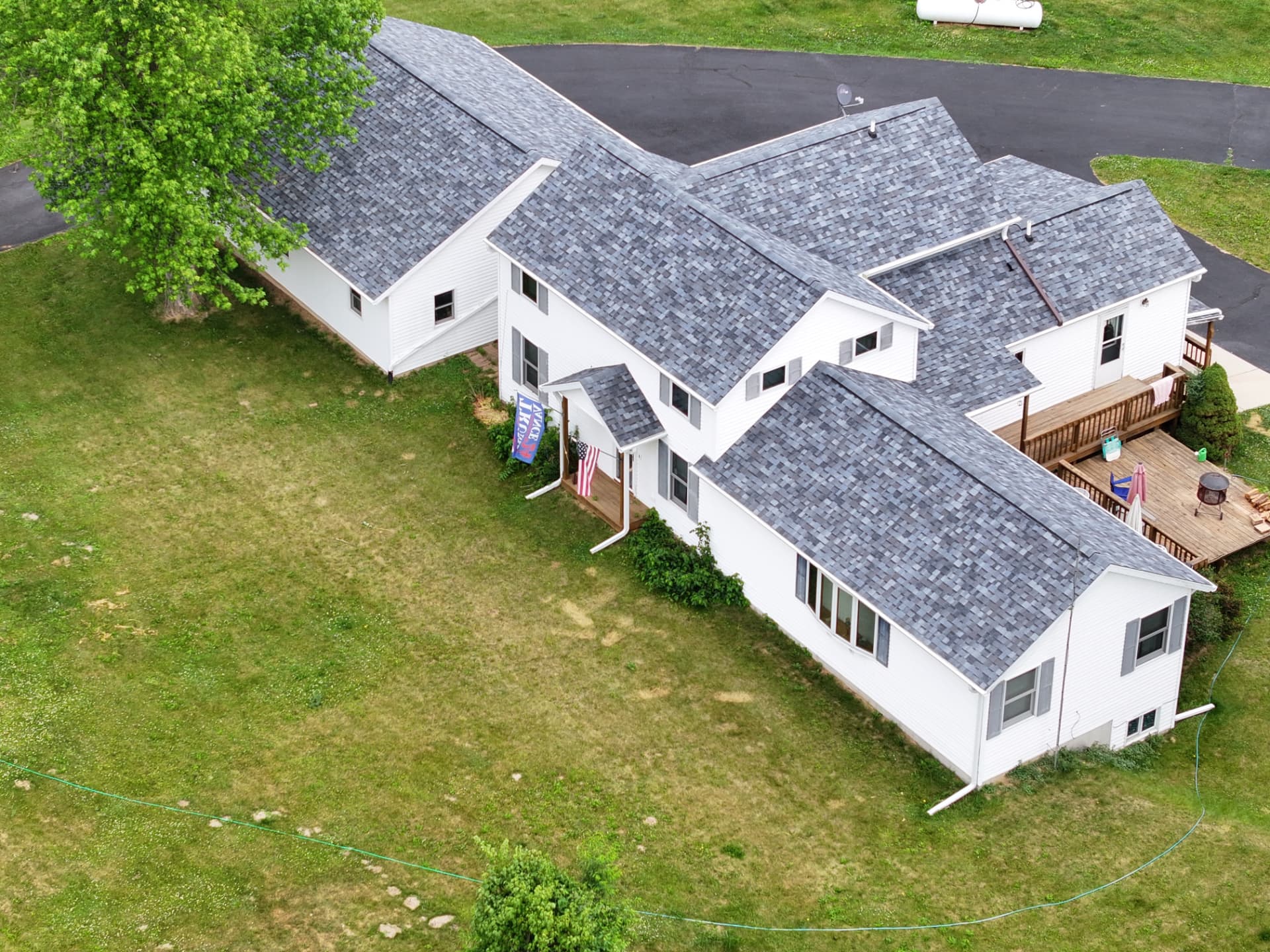 Aerial view of a completed Hammer It Construction shingle roof on a Freeport, Illinois home